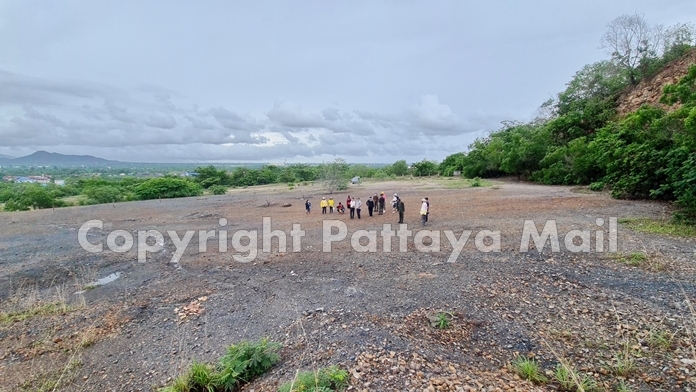 Navy inspectors and local villagers have a look around the area.