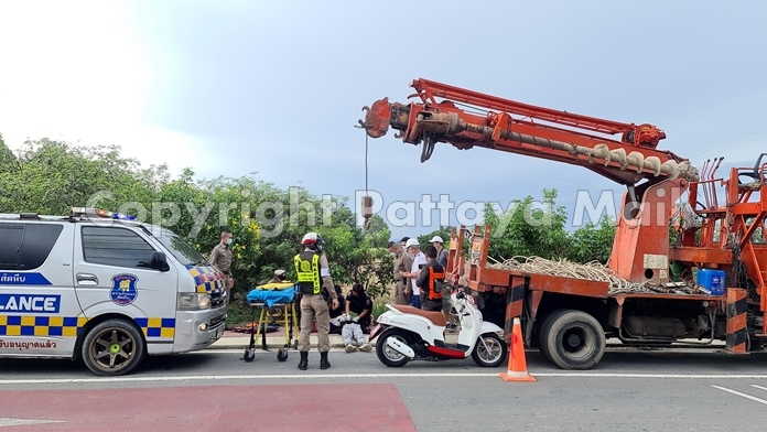 A rescue team provides emergency care before sending Ponwat Makkot to hospital after he was seriously injured after driving his motorbike into a parked crane in Najomtien.