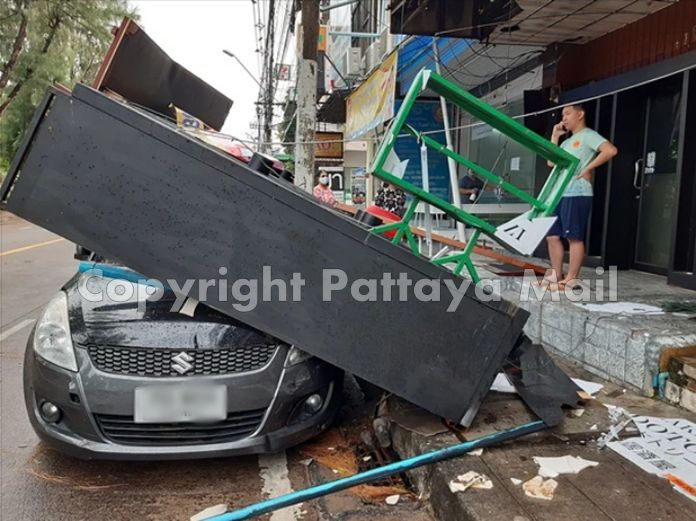 Lashing rain and wind damaged a Suzuki Swift when part of the roof on a closed restaurant blew off.