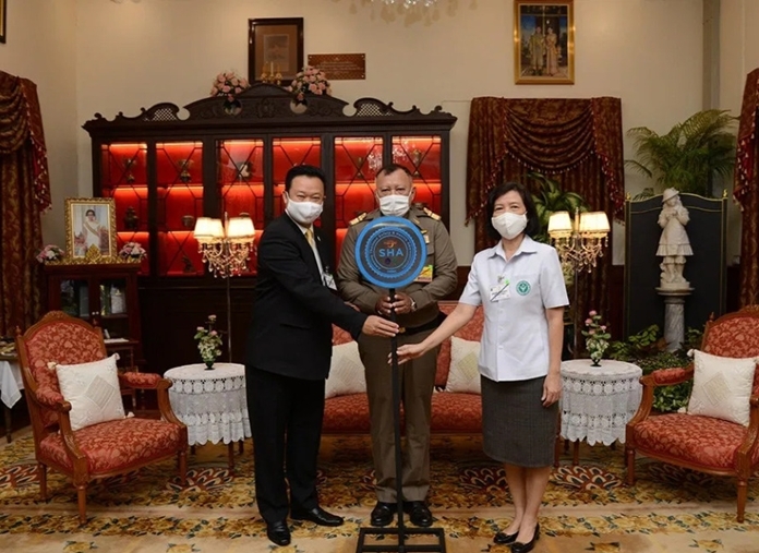 The Amazing Thailand SHA is presented by Mr. Yuthasak Supasorn (left), TAT Governor, to AVM Supichai Soonthornbura (centre), Deputy Secretary-General of the Bureau of the Royal Household.  Also joining the certificate presentation are Dr. Phanpimol Wipulakorn (right), Director-General, Department of Health, Ministry of Public Health.