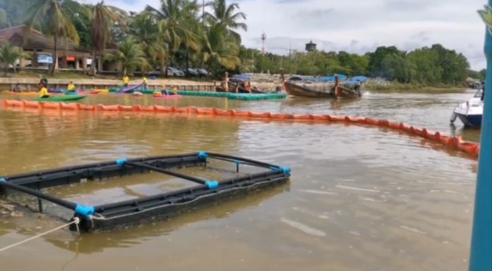 Trash booms were installed in the Tapi River to contain floating trash and debris before reaching the ocean.