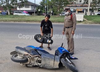 Angry Thai man tries to destroy out-of-gas motorbike