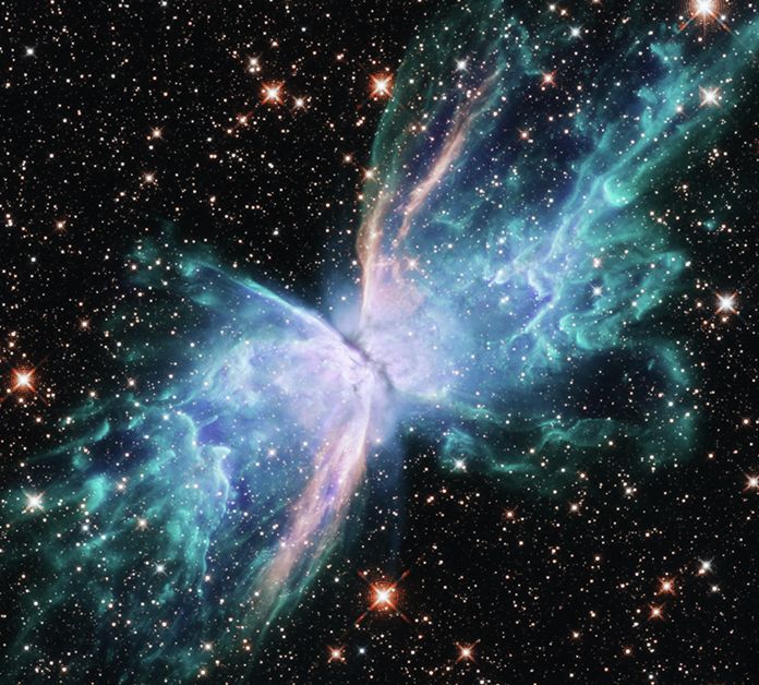 Hubble was recently retrained on NGC 6302, known as the “Butterfly Nebula,” to observe it across a more complete spectrum of light, from near-ultraviolet to near-infrared, helping researchers better understand the mechanics at work in its technicolor “wings” of gas. (Credits: NASA, ESA and J. Kastner (RIT))
