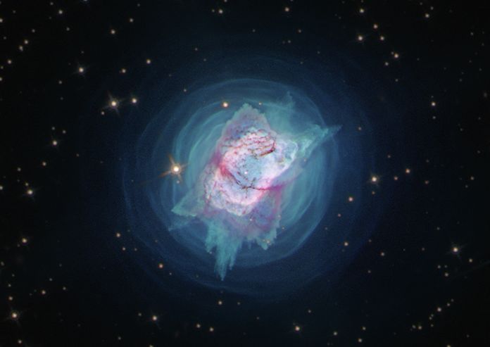 Recently, NGC 7027’s central star was identified in a new wavelength of light — near-ultraviolet — for the first time by using Hubble’s unique capabilities. This object, which resembles a colorful jewel bug, is a visibly diffuse region of gas and dust that may be the result of ejections by closely orbiting binary stars that were first slowly sloughing off material over thousands of years, and then entered a phase of more violent and highly directed mass ejections. (Credits: NASA, ESA and J. Kastner (RIT))