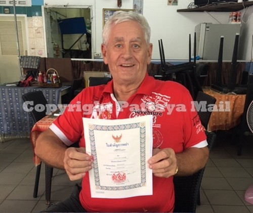 Paul Tattersfield displays his hard-to-obtain Thai divorce certificate.