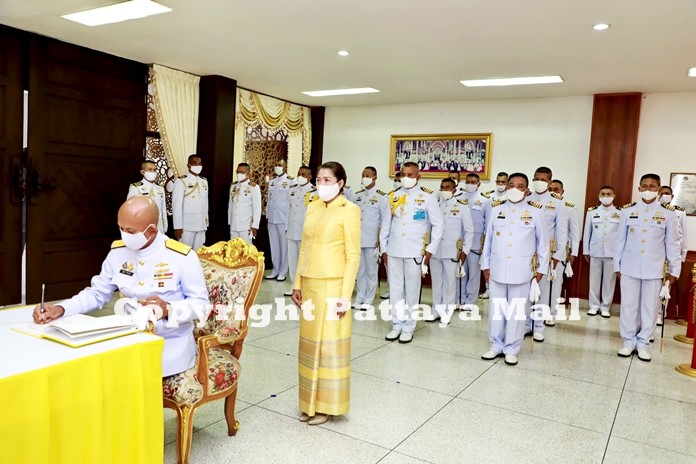 Vice Adm. Utai Chewasutti, Commander of the Air and Coastal Defence Command signs a book to wish HM the King a long and healthy life.