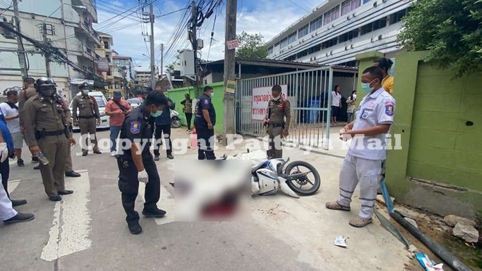 Police and emergency units inspect the scene where Pratum Saardnuk was shot dead.