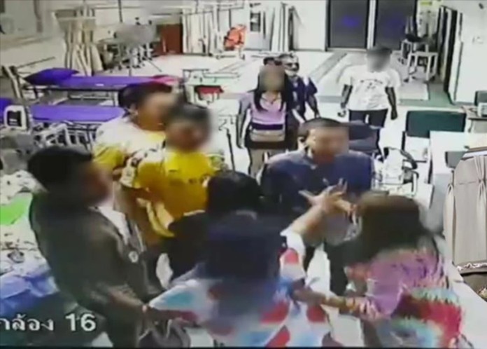 About a dozen people are arrested after intruding and attacking officials at Vibharam Chaiprakan Hospital and then Muangsamut Hospital where their injured rivals were being treated.