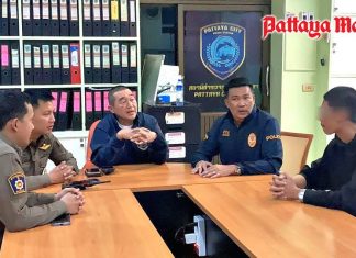 Pol. Col. Navin Teerawit (centre) interrogates Wachirawit, after his surrender at the Pattaya City Police Station, confessing to performing the wheelie in the Pattaya underpass. He faces multiple charges and potential prison time, highlighted by this arrest.