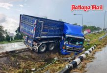 Trailer skids on rainy Pattaya road, head cab collapses into median, 2 injured