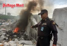 Jomtien officials catch man burning stolen cables to extract copper in illegal dumping area