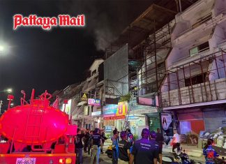 Midnight blaze tears through Pattaya pharmacy building as firefighters race to contain flames