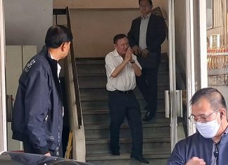Thaksin reports to Probation Office wearing EM bracelet, calls process ‘Just a Formality’