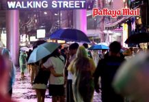Rain batters Pattaya on Sunday night as visitors seek shelter across Walking Street