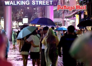 Rain batters Pattaya on Sunday night as visitors seek shelter across Walking Street