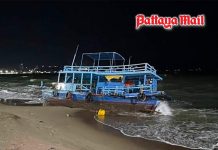 Pattaya tour boat breaks free 200 meters offshore before waves smash it onto beach