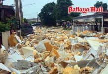 Foam waste flood destroys housing estate wall in Bo Win, Sri Racha