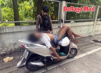 Bangkok Police check on man sleeping on running motorcycle for his safety