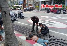 Face down beside busy road Pattaya officials rush to save woman
