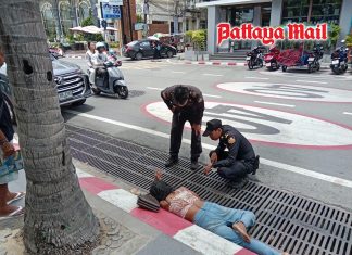 Face down beside busy road Pattaya officials rush to save woman