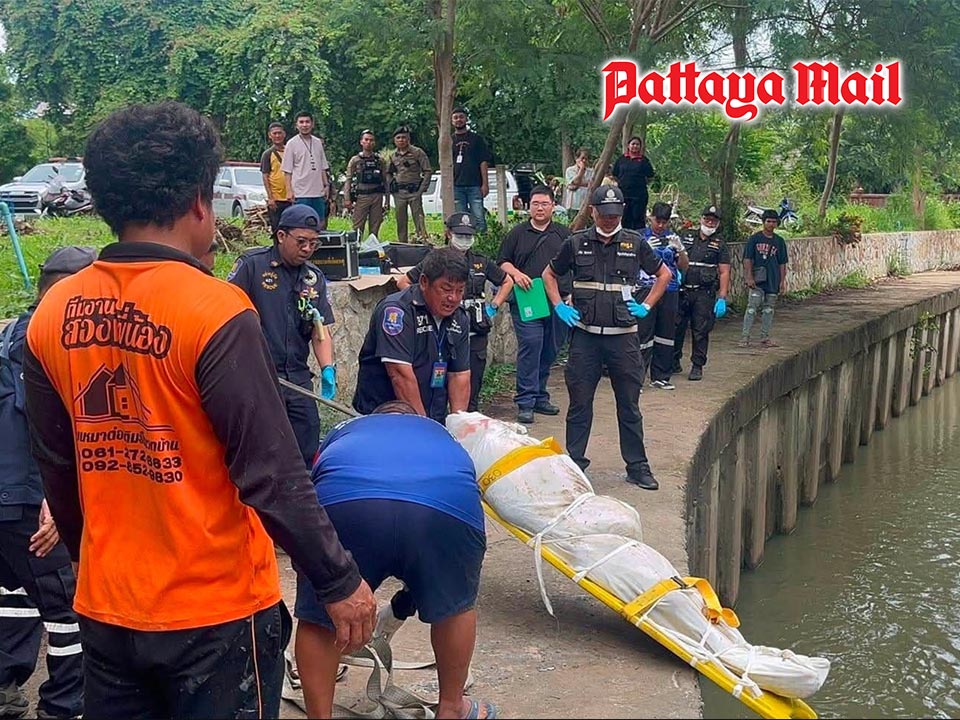 Mystery man found dead floating in Pattaya canal wearing guard shirt