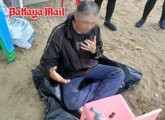 Pattaya officials take man for medical assessment after beach threats