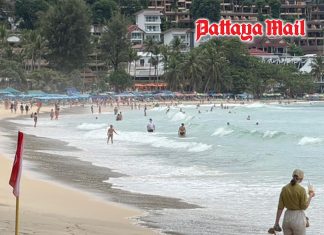Tourists brave rough seas at Phuket’s Kata Beach despite red flags