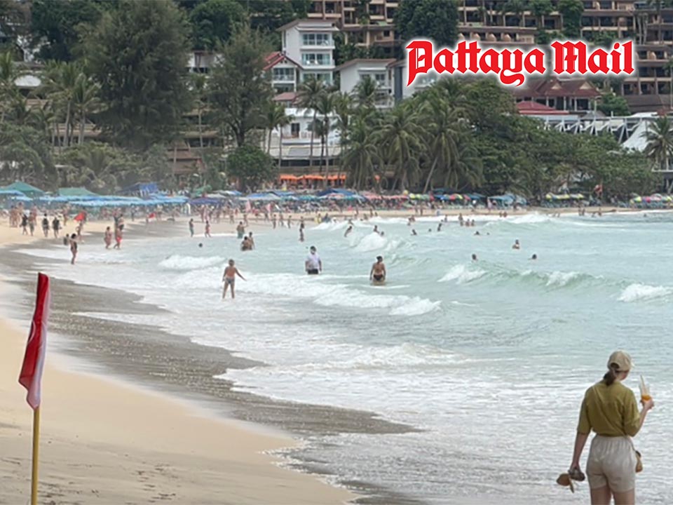 Tourists brave rough seas at Phuket’s Kata Beach despite red flags