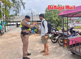Krabi Tourist Police help visitors arrange boat trips at Noppharat Thara Beach