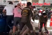Furious driver floors traffic cop with elbow during license check in Bangkok