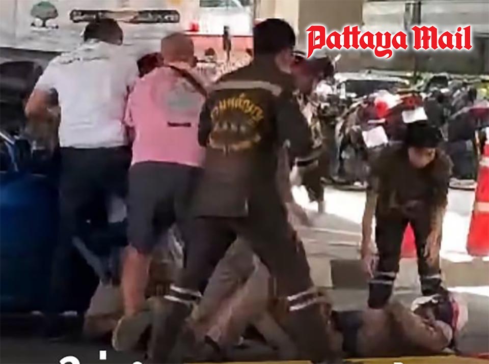 Furious driver floors traffic cop with elbow during license check in Bangkok
