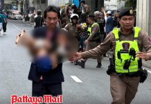 Child carried to safety after police negotiate release under Bangkok bridge