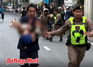 Child carried to safety after police negotiate release under Bangkok bridge