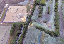 Oil-like sheen found in floodwater near industrial waste landfill in Prachin Buri