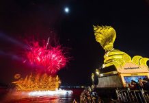 Nakhon Phanom illuminates Mekong with 12 boats for Buddhist Lent festival