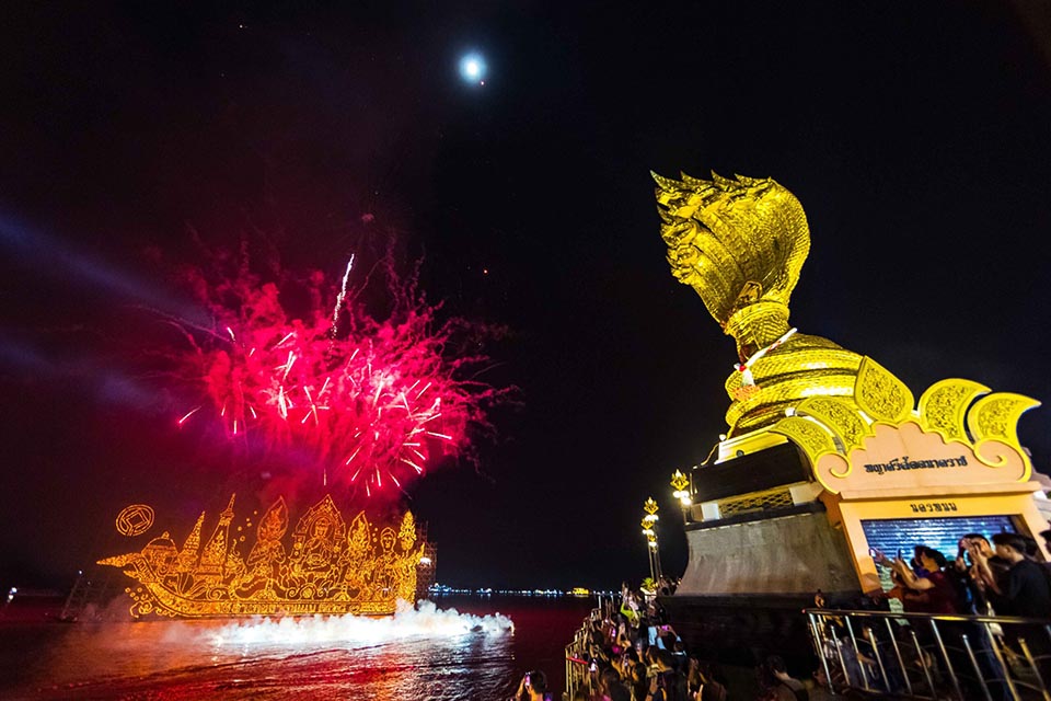 Nakhon Phanom illuminates Mekong with 12 boats for Buddhist Lent festival